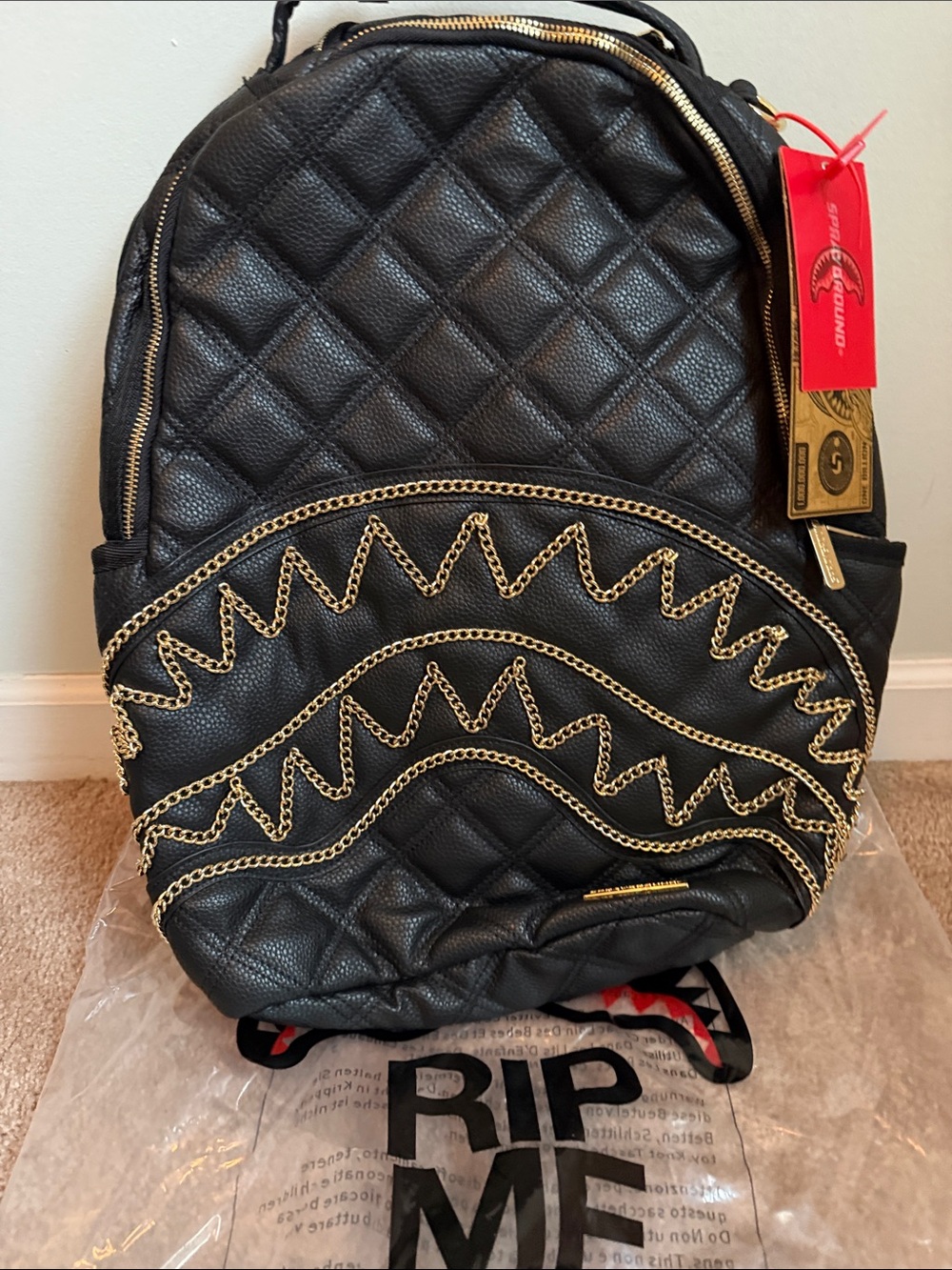 Quilted Black Backpack with Gold Chain Trim